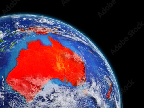 Australia from space. Planet Earth with extremely high detail of planet surface and clouds. Continent highlighted in red.