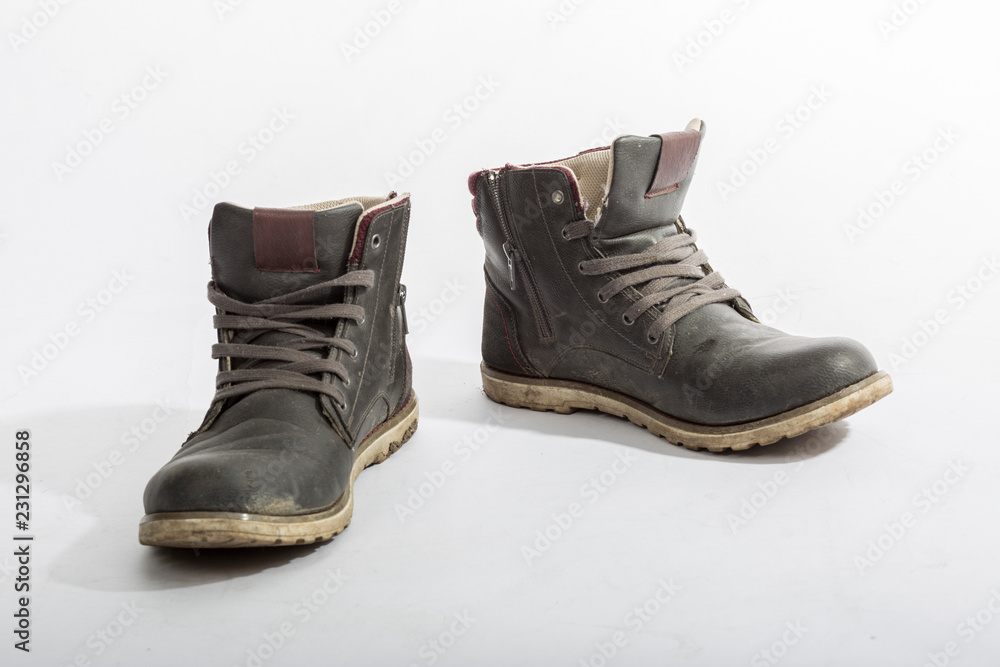 Two old dirty shoes isolated Two old dirty shoes isolated