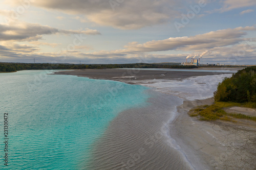 Wallpaper Mural Turquoise water of lake powered by power plant mineral waste. Aerial view. Torontodigital.ca