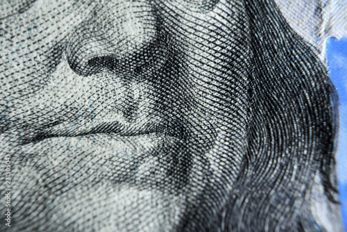 Dolar USA close up. Bennjamin Franklin mouth. The texture of the fragment of the dollar bill. USD banknote texture. Silence for a bribe.