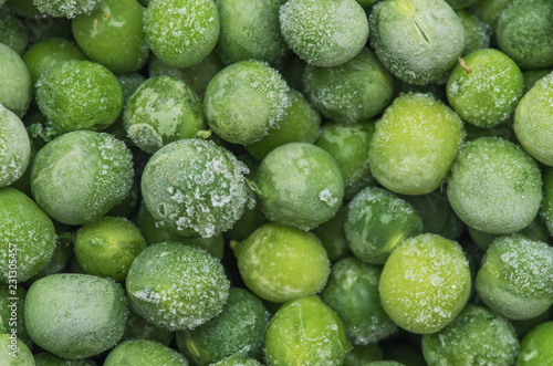 Closeup of a heap of frozen peas