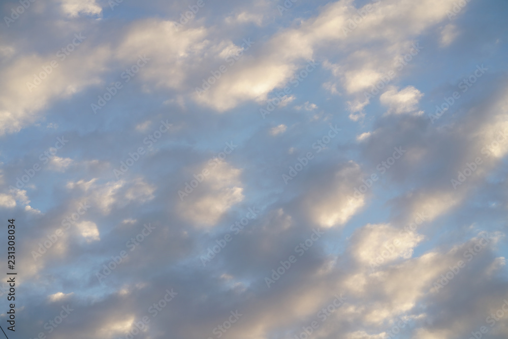 clouds illuminated by the sun. white cumulus clouds illuminated by the sun. white cumulus