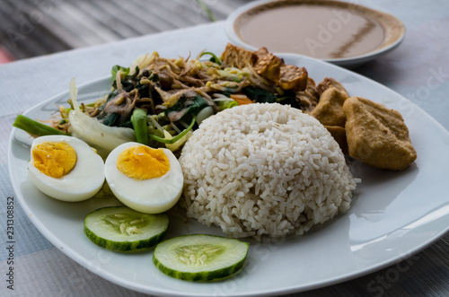 GADO GADO typical Indonesian salad with hard-boiled eggs, boiled potato, fried tofu and tempeh and peanut sauce.