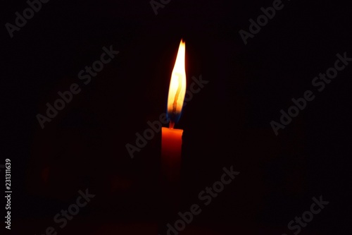 Orthodox Christian church candle burns at night