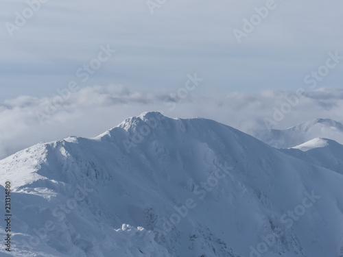 View of the snowy peaks and slopes of the mountains Low Tatras, Slovakia. © Peter