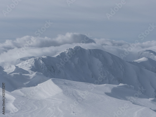 View of the snowy peaks and slopes of the mountains Low Tatras, Slovakia.