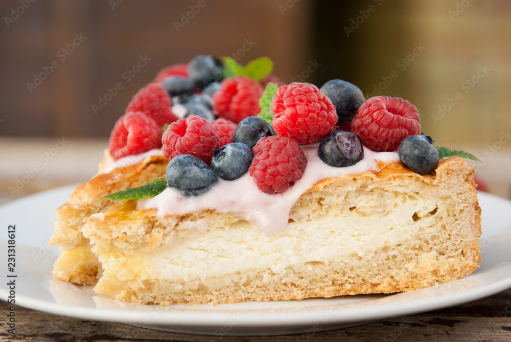 Homemade cheesecake with fresh berries and mint for dessert - healthy organic summer dessert pie cheesecake. Homemade cheesecake with fresh berries and mint for dessert - healthy organic summer dessert pie cheesecake.