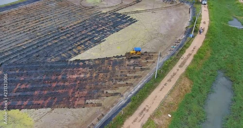 Aerial view of bulldozer on muddy 2