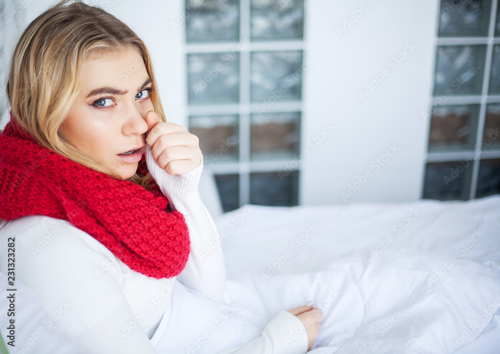 Sick woman with flu. Woman Suffering From Cold Lying In Bed With Tissue Sick woman with flu. Woman Suffering From Cold Lying In Bed With Tissue