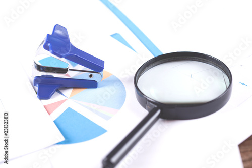 magnifier on the finance graph paper background