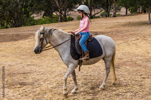 Young child learning to ride in the upper Hunter Valley, NSW, Australia.