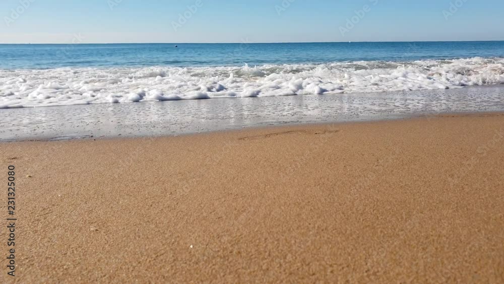 The wave floods the sandy shore. Beach, sand, waves, warm, sunny. Turkey is summer. The wave floods the sandy shore. Beach, sand, waves, warm, sunny. Turkey is summer.
