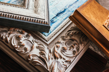 Decorative classic picture frames. Wooden frames background.