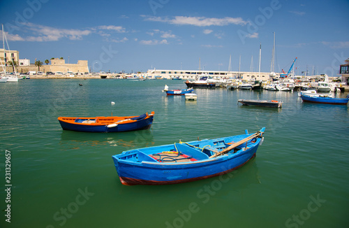Colorful fishing boats in harbour of Bari city, Puglia, Southern Italy