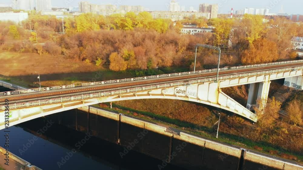 Sluice Gates on the River. Aerial view barge, ship in the river gateway in autumn sunny day. Sluice Gates on the River. Aerial view barge, ship in the river gateway in autumn sunny day.