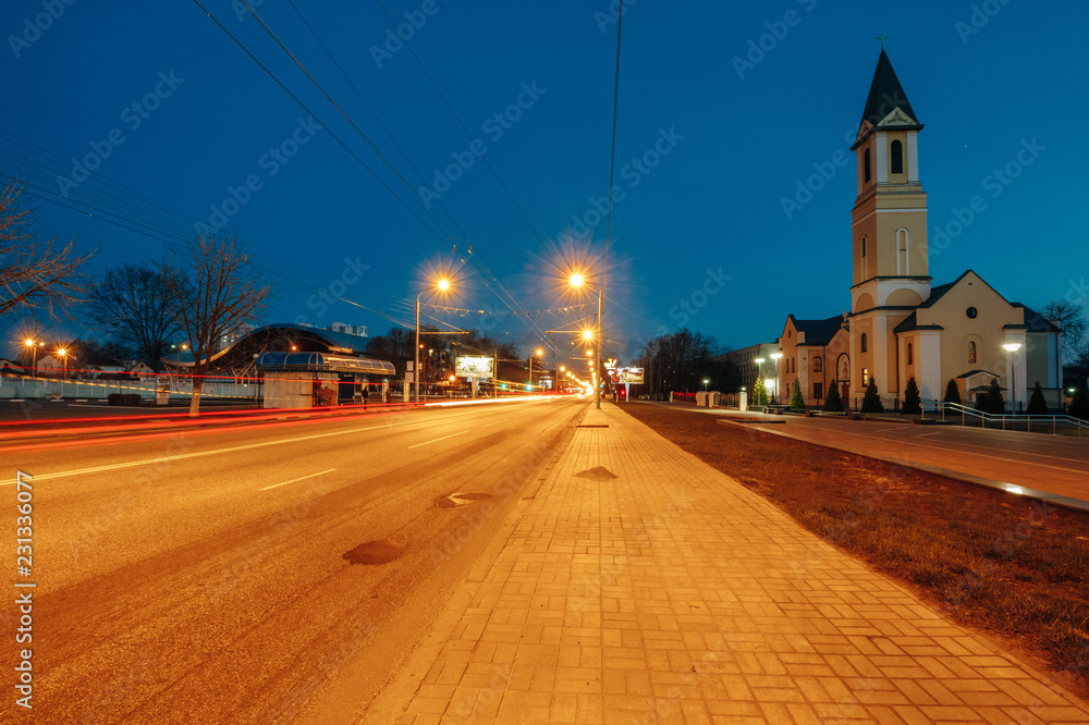 The night city of Gomel With the road and the Catholic church