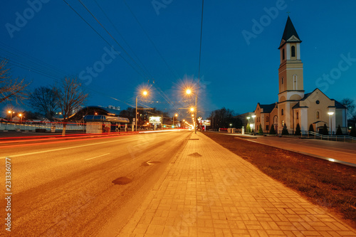 The night city of Gomel With the road and the Catholic church