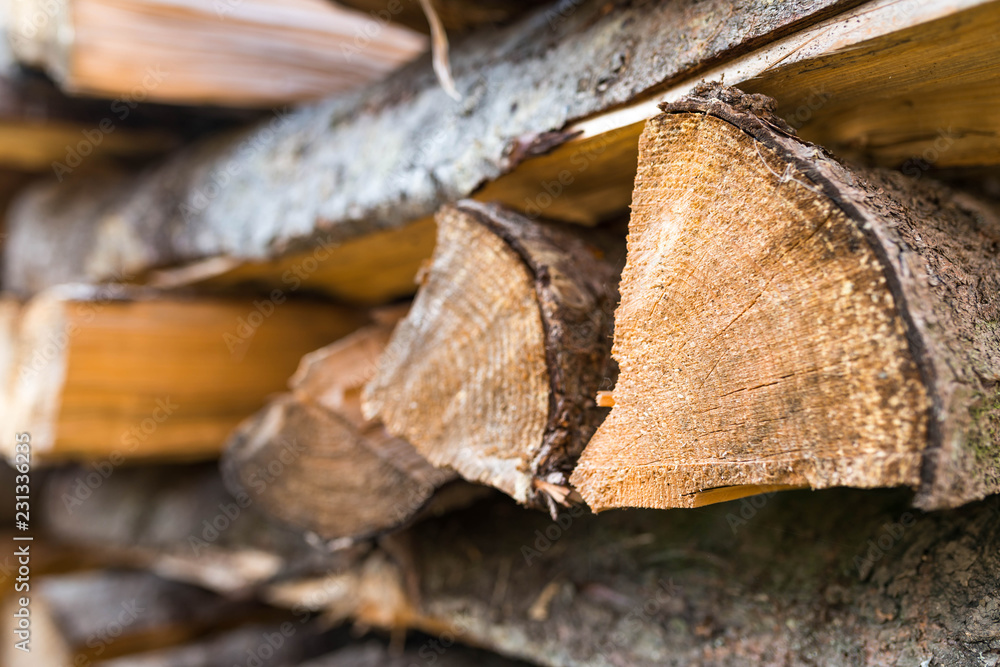 Stack of pine fire woods for the cold season close up shot, shallow depth of field.