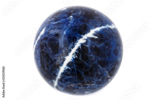 Macro mineral stone Sodalite ball on white background