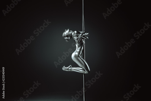 Young woman pole dancing