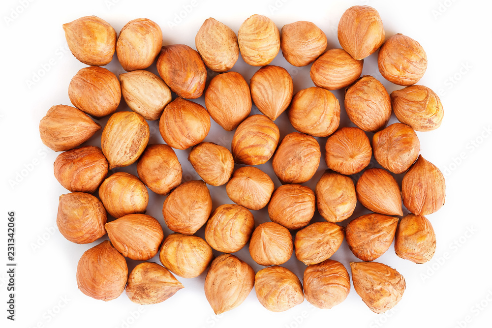 Heap of hazelnuts isolated on white background, macro image Heap of hazelnuts isolated on white background, macro image