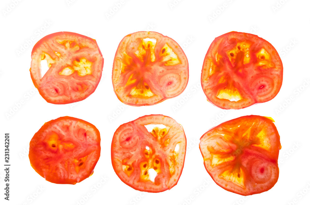 Cross-section of a tomato on a lumen isolated on a white background. Cross-section of a tomato on a lumen isolated on a white background.