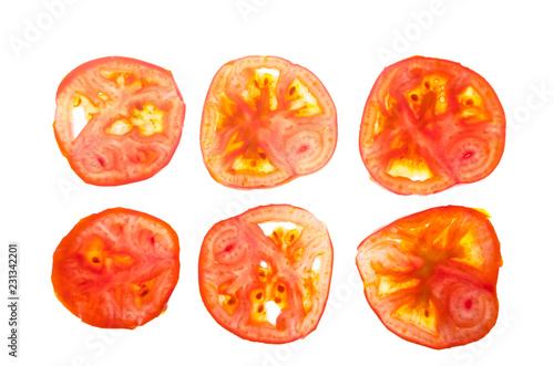 Cross-section of a tomato on a lumen isolated on a white background.