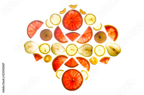Composition of longitudinal and transverse cuts of fruits of various shapes on the lumen isolated on white background.