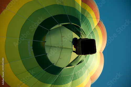 hot air balloon in the sky below basket