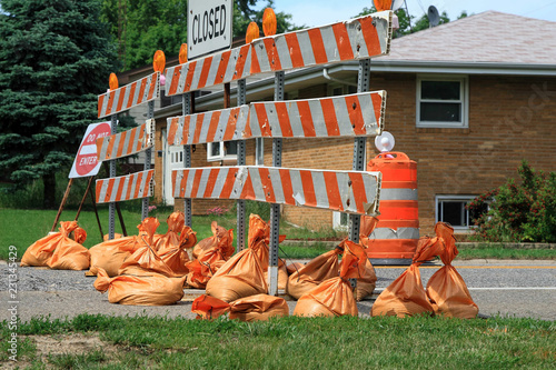 closed road and lots of closed sandbags photo