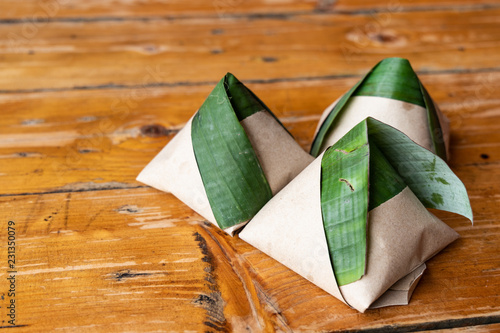 Simple authentic nasi lemak wrapped in banana leaf for breakfast