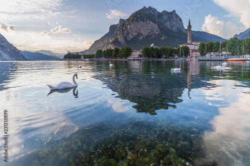 Lecco, lake Como, Lombardy, Italy. View of the city with the St. Martin mount reflected in the lake's waters photo