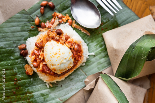 Bild auf Leinwand Simple authentic nasi lemak wrapped in banana leaf for breakfast