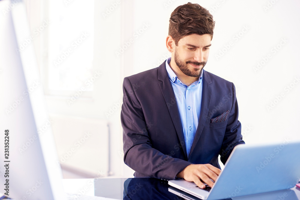 Young financial assitant businessman with notebook in the office Young financial assitant businessman with notebook in the office