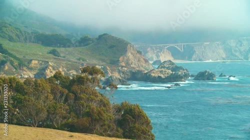 Telephoto: Bixby Creek Bridge and cliffs tower above the Pacific at Big Sur
