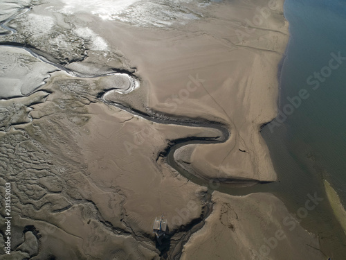 Intertidal sands and river in Estuary photo