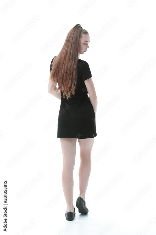 rear view.beautiful woman model in short black dress .isolated on white rear view.beautiful woman model in short black dress .isolated on white