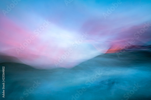 Abstract of blue water with pink sky