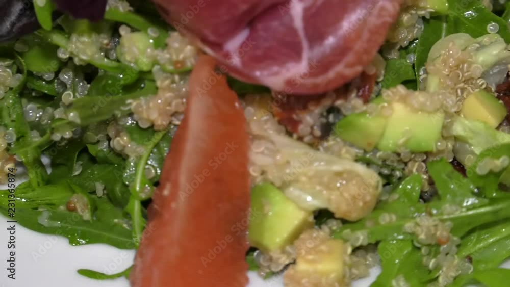 Salad was decorated with grapefruit slices. Salad consists of arugula leaves, avocado, quinoa croup. Salad was decorated with grapefruit slices. Salad consists of arugula leaves, avocado, quinoa croup.