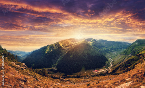 fantastic colorful landscape at sunset. overcast clouds glowing in sunlight  Beautiful summer landscape in the Fagarash mountains. artistic creative image. soft light effect. Transfagarasan road 
