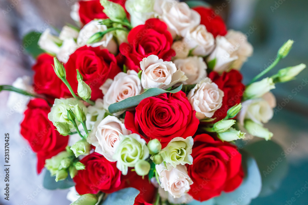 bridal bouquet of white and red roses
