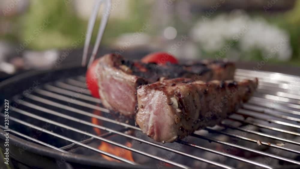 close up of cooking pork ribs on the grill barbecue close up of cooking pork ribs on the grill barbecue