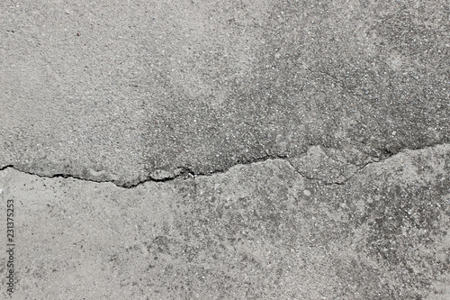 Asphalt surface detail horizontal background uneven with crack fracture