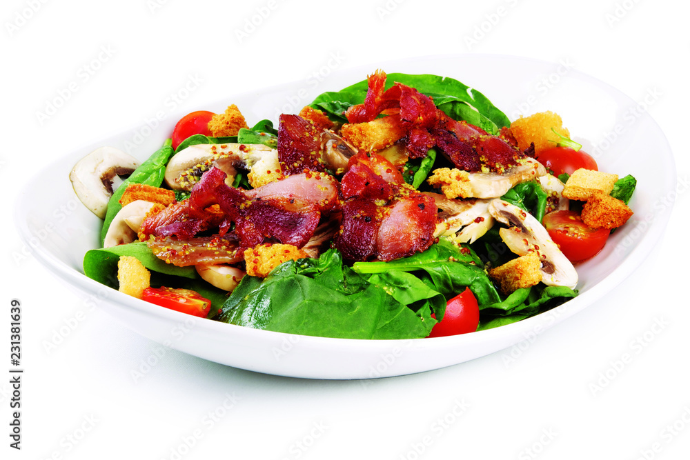 Green garden salad with spinach, cherry tomato, bacon, chicken on a fancy plate, white on white background, isolated; Green garden salad with spinach, cherry tomato, bacon, chicken on a fancy plate, white on white background, isolated;