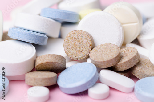 pills and tablets close-up, soft focus