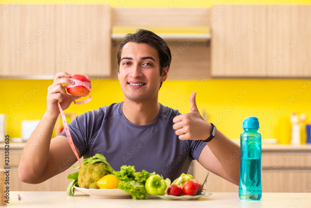 Young man in dieting and healthy eating concept Young man in dieting and healthy eating concept