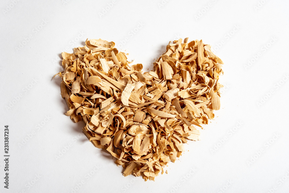 Wooden shavings heart shape isolated on white background Wooden shavings heart shape isolated on white background