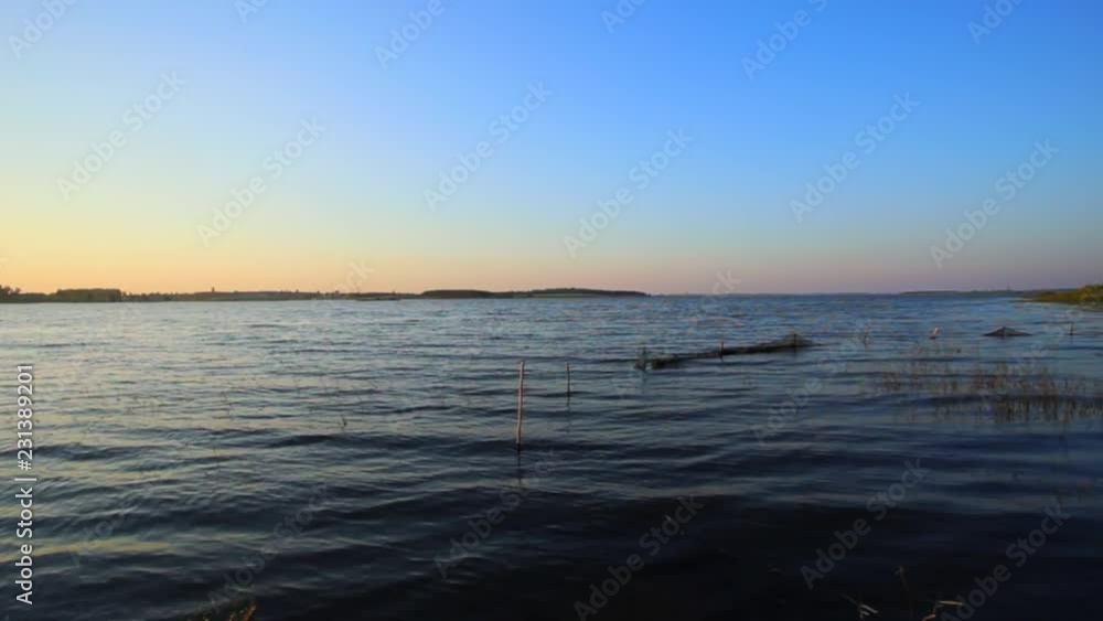 Rural river landscape summer river with bright sky and cloud. Boat in the river Rural river landscape summer river with bright sky and cloud. Boat in the river