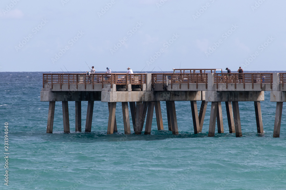 fishing pier with people fishing