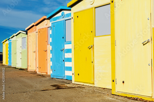 Seaside beach huts on Seaford beach, East Sussex. England, selective focus